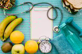 fitness-concept-with-stethoscope-clipboard